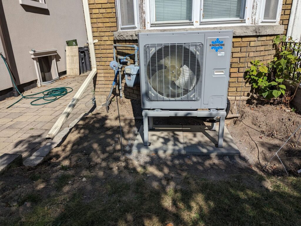 front view of toronto heat pump installation with landscape change